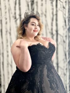 Gorgeous plus size bride to be wearing a black a line wedding dresses and matching tiara from Mirror Mirror Bridal.