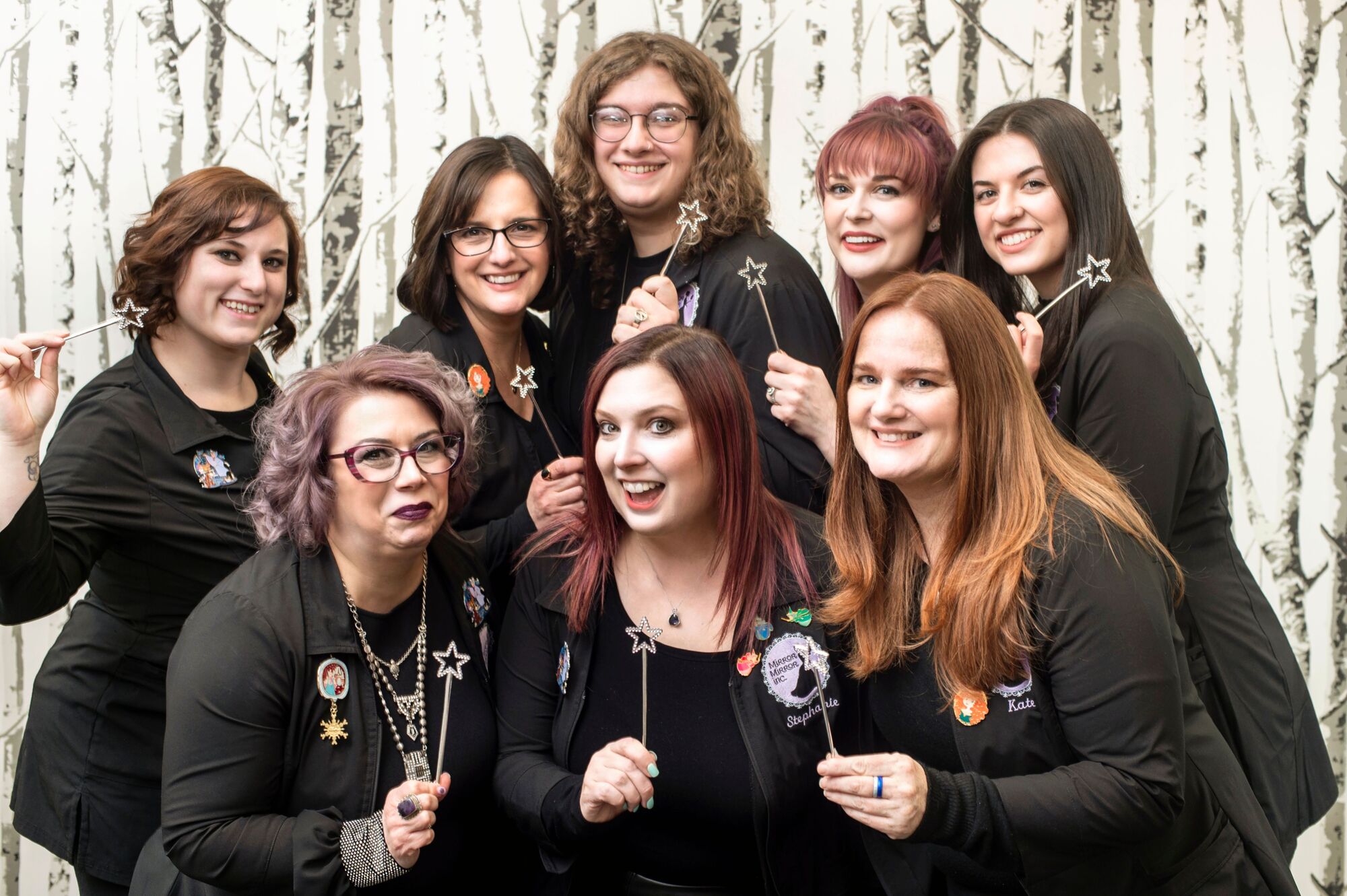 Mirror Mirror Bridal Boutique Staff group shot. They are all holding little wands.